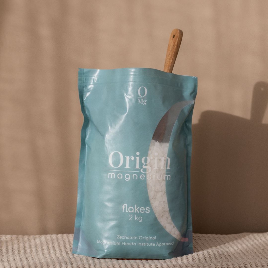 Magnesium Flakes, open bag with wooden spoon